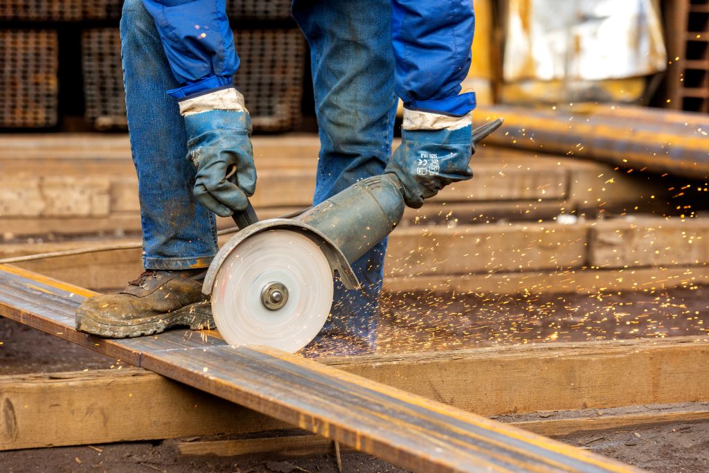 person chops steel plate